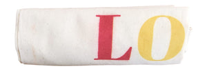 Reusable cotton grocery tote bag rolled up for packing light